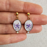 Boucles d'oreilles noeuds parmes