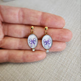 Boucles d'oreilles noeuds parmes