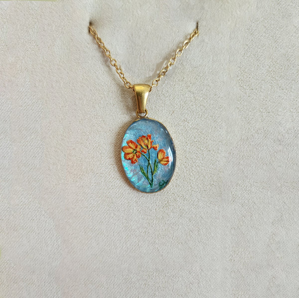 Pâquerette orange sur fond bleu