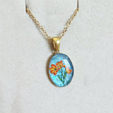Pâquerette orange sur fond bleu
