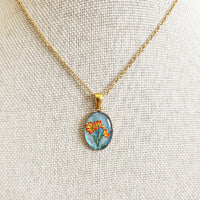 Pâquerette orange sur fond bleu